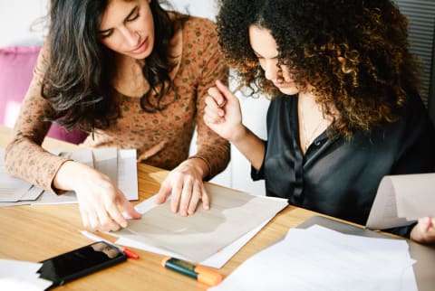 Woman Tutoring Another Woman in School Woman Tutoring Another Woman in School