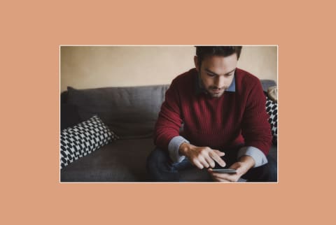 A man swiping on dating apps on his phone. A man swiping on dating apps on his phone.